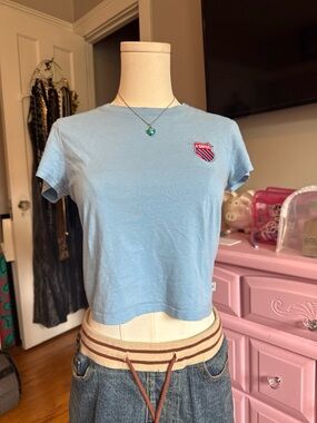 K-Swiss Light Blue Cropped Crewneck Tee with Shield Patch - Womens